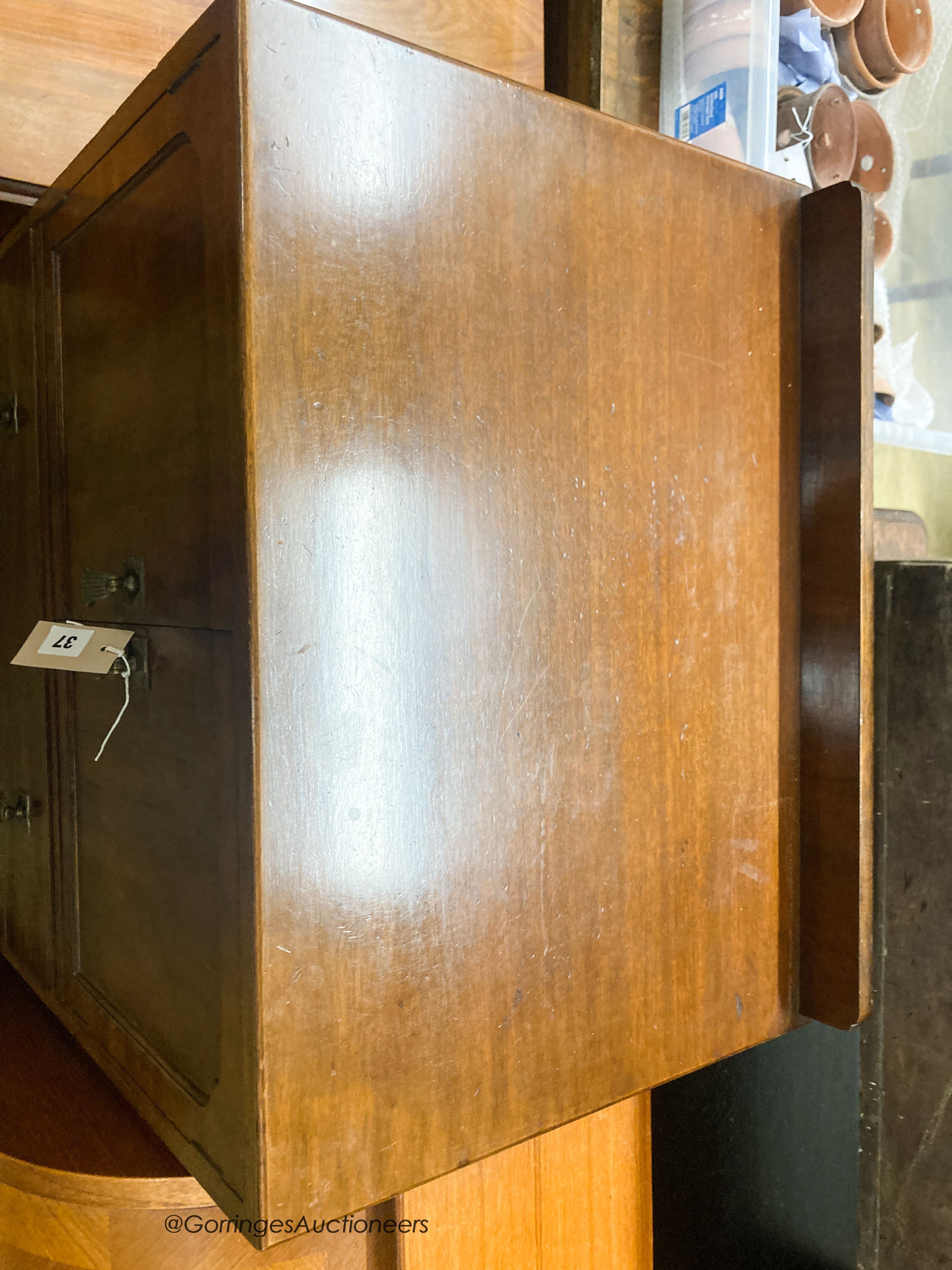 A 1920's mahogany three drawer side cabinet, stamped Waring & Gillow, W.61cm D.44cm H.110cm